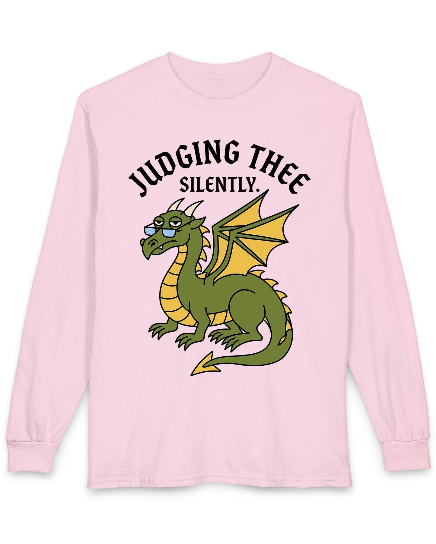 Judging Thee Silently shirt in light pink featuring a judgmental green dragon with glasses, folded wings, and text
