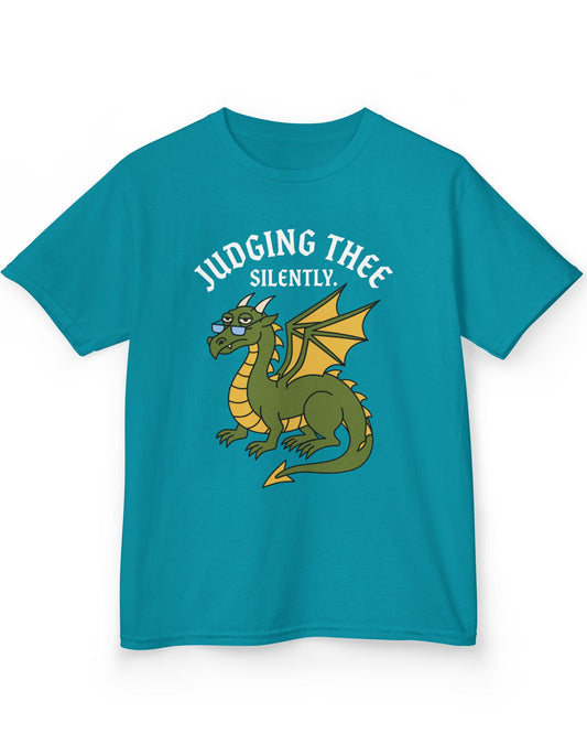 Judging Thee Silently shirt in tropical blue featuring a judgmental green dragon with glasses, folded wings, and text