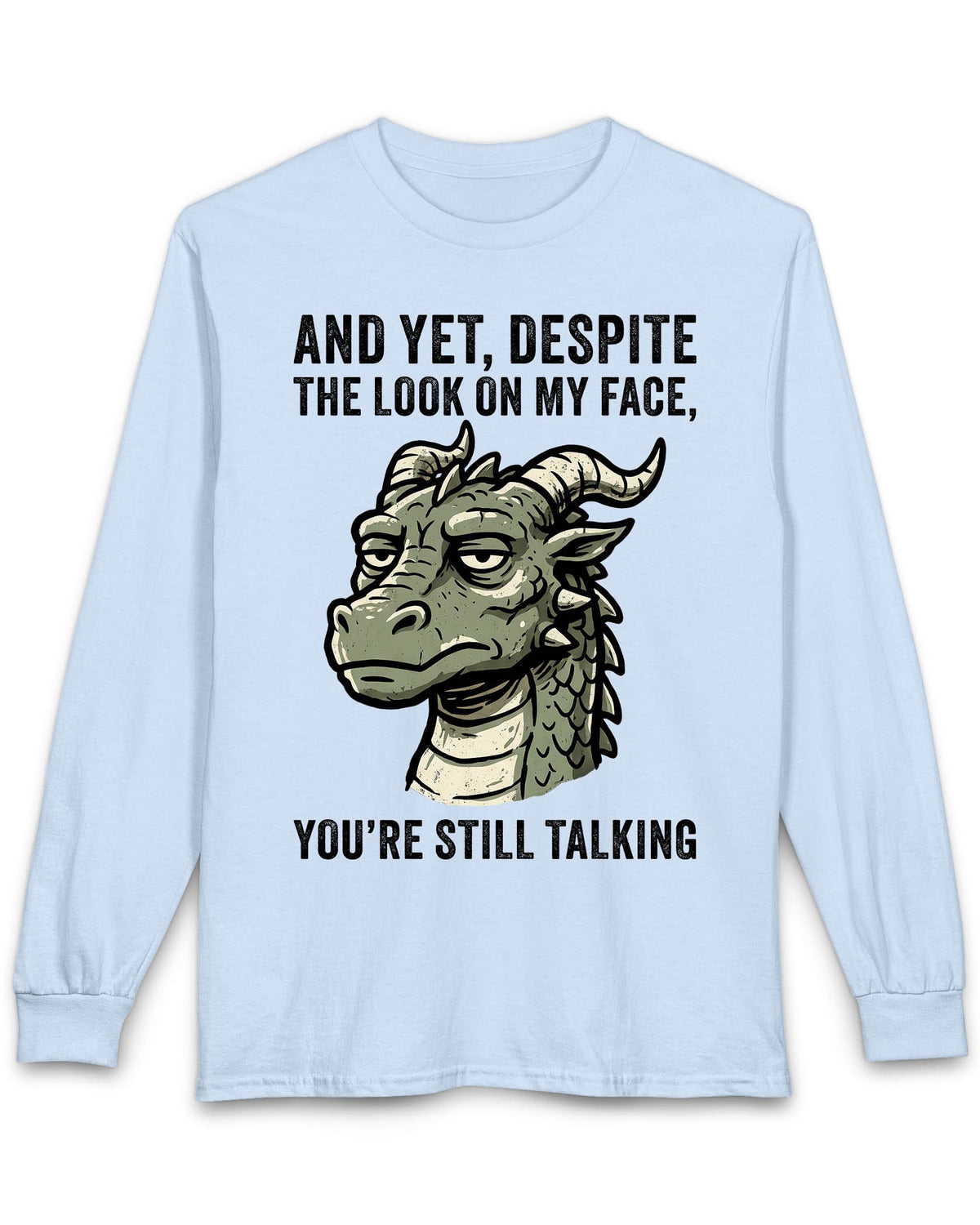 You're Still Talking shirt in light blue featuring a weary green dragon and distressed text