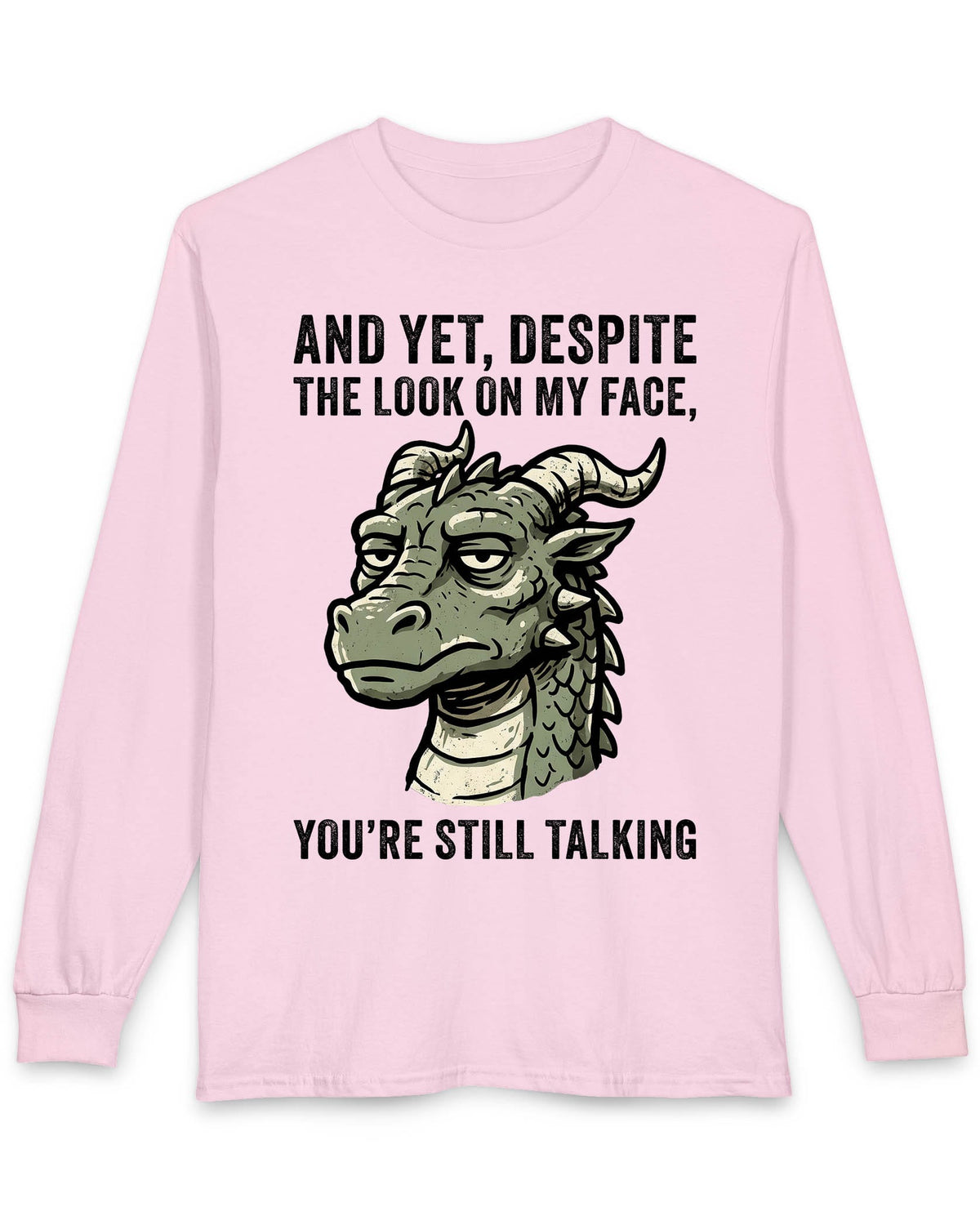 You're Still Talking shirt in light pink featuring a weary green dragon and distressed text