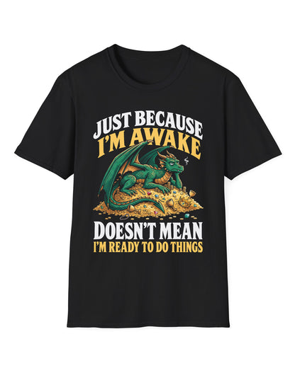 Just Because I'm Awake shirt in black featuring a sleepy green dragon lounging on a pile of gold beneath bold text