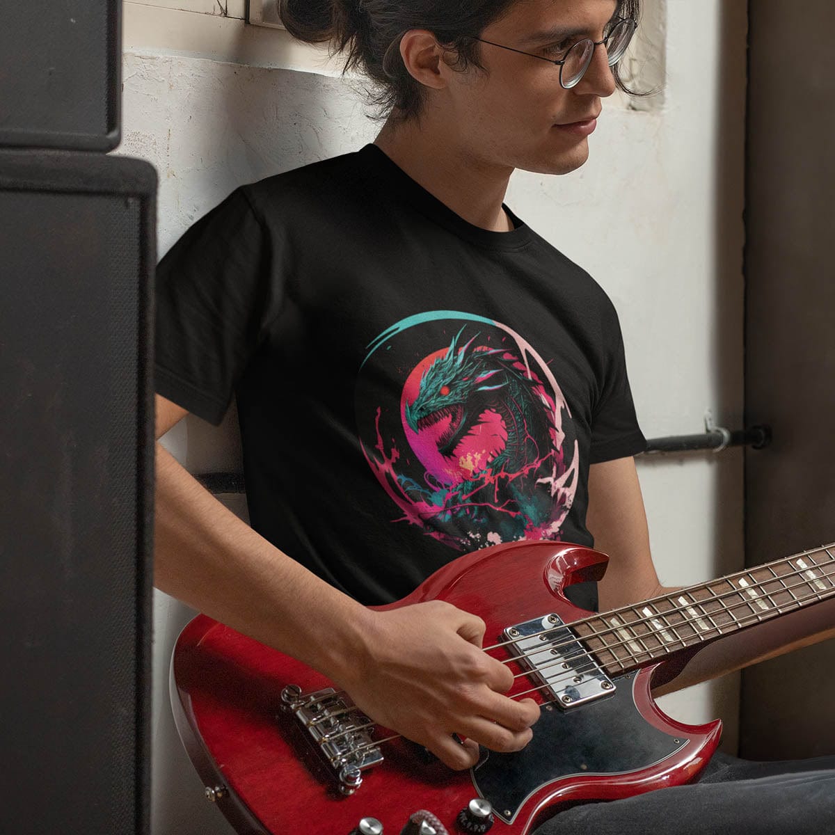 Man playing an electric guitar while wearing an Angry Dragon Shirt featuring a fierce snarling dragon with electric energy.