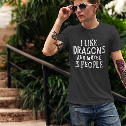 Man wearing an I Like Dragons and Maybe 3 People Shirt with a distressed text-only design, standing casually with sunglasses.