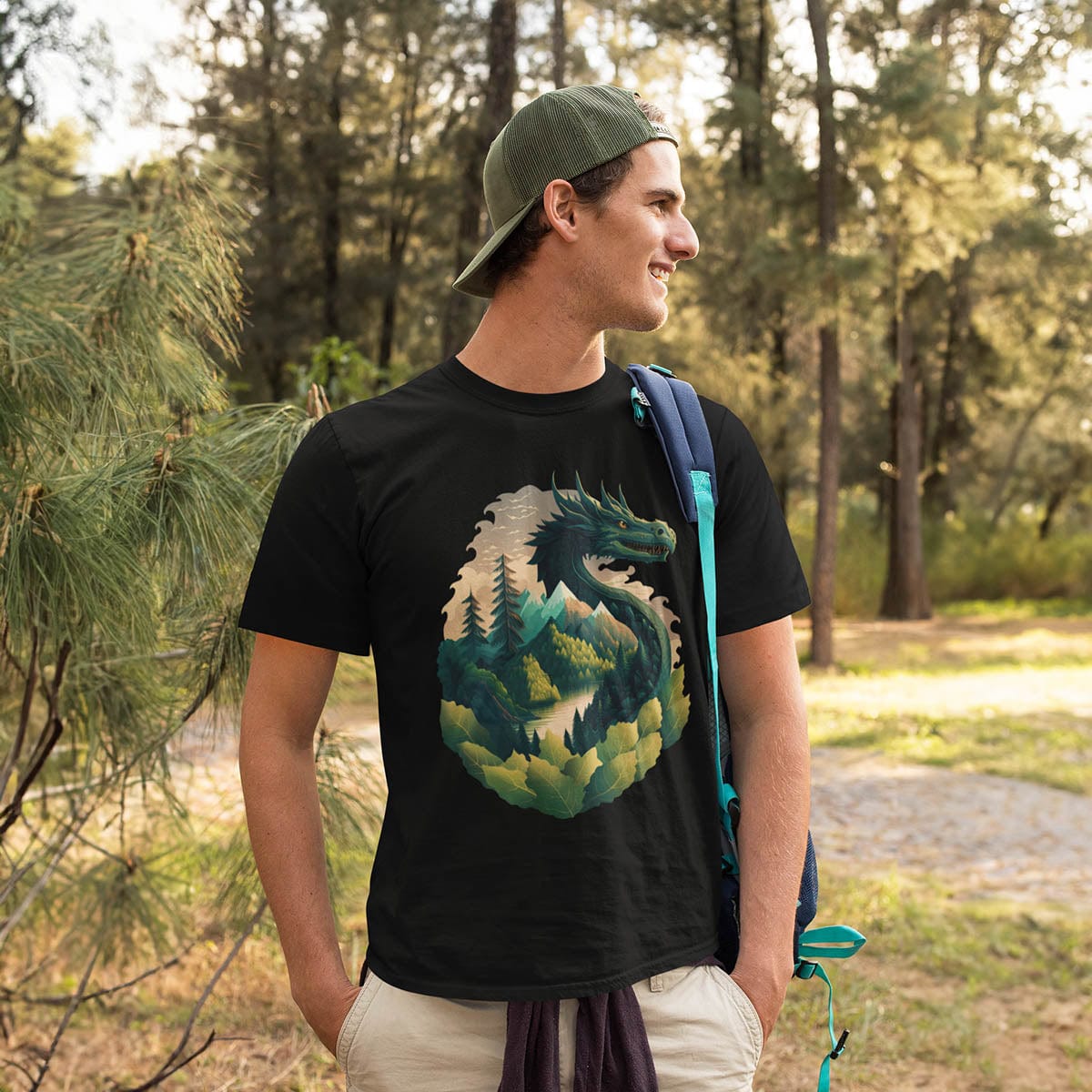 Man outdoors, enjoying nature, wearing a Go Green Dragon Shirt featuring a green dragon blending into a mountain landscape.