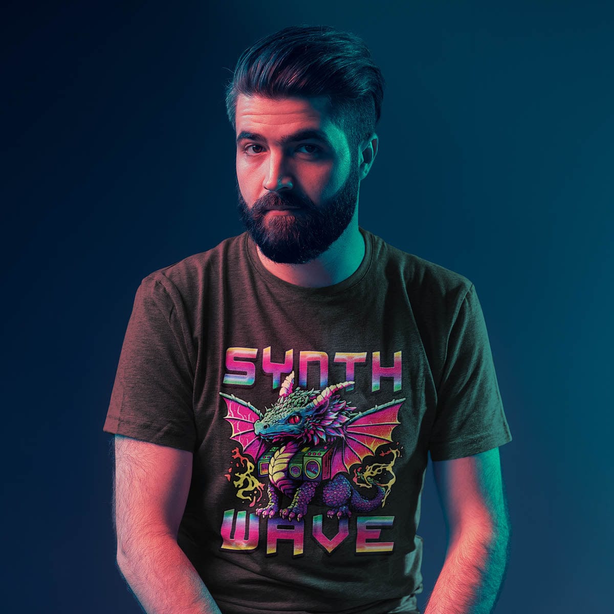 Man in retro lighting wearing a Synthwave Dragon Shirt with the word "SYNTHWAVE" and neon art of a dragon with a boombox.